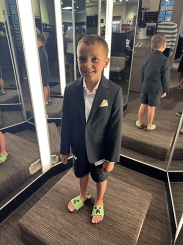 Owen in a suit jacket and Minecraft sandals